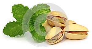 Pistachios with green mint leaves