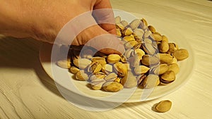 Pistachios health kernel hand appetizer table wooden plate background