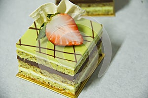 Pistacho layer cake and chocolate garnache photo