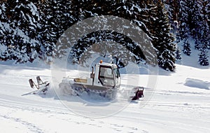 Piste basher in the mountain