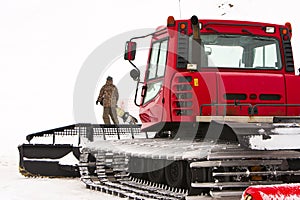 Piste preparation vehicles on a slope