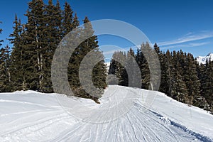 Piste ski track in alpine ski resort