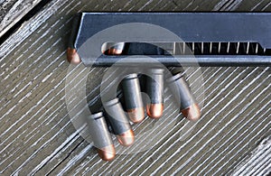 Pistol Cartridges On Wood