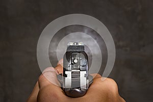 Pistol hand gun shooting