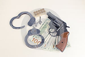 Pistol, handcuffs ammunition and money.