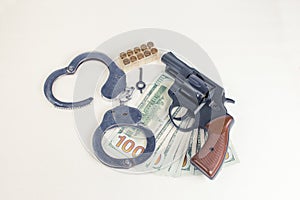 Pistol, handcuffs ammunition and money.