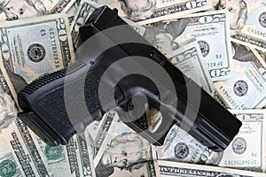 Pistol on money