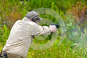 Pistol Shooter Firing Round