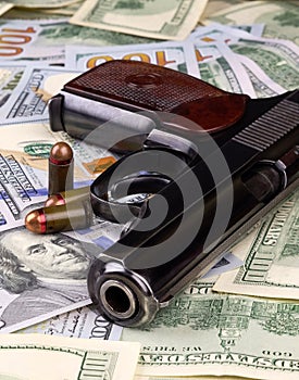 Pistol and US dollars