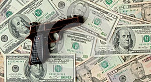 Pistols against the background of dollars