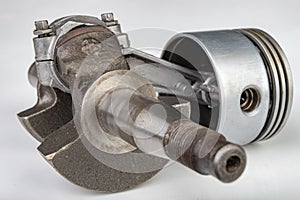 Piston and connecting rod of a small combustion engine. Components needed for mounting a high-power generator