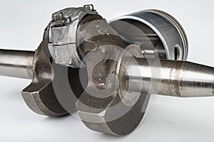 Piston and connecting rod of a small combustion engine. Components needed for mounting a high-power generator