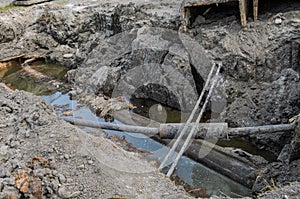 A pit dug to repair a water pipe accident