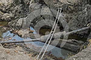 A pit dug to repair a water pipe accident