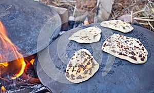 Pita bread baking on a Saj or Tava