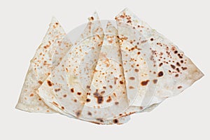 Pita bread with cottage cheese and greens on a white background