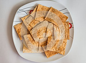 Pita chips in white plate