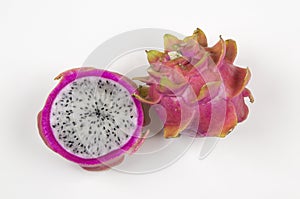 Pitayas/Dragonfruits halves over white background