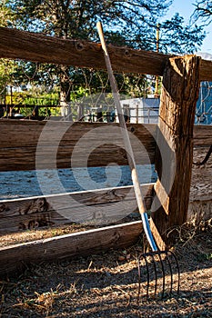 Pitch Fork Leaning on Fence