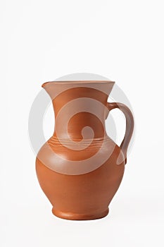 Pitcher ceramic with handle. Isolated on white background. Close-up.