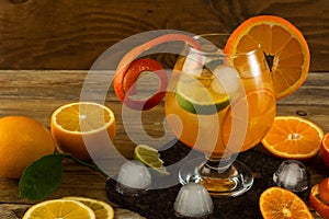 Pitcher of cool lemonade on wooden table