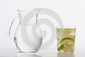 Pitcher and glass cup with lime