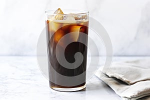 pitcher of homemade cold brew coffee on a marble surface