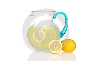 Pitcher of lemonade with fresh lemons