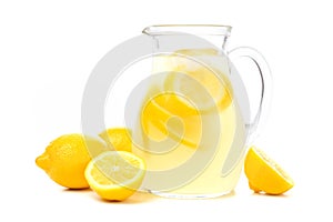 Pitcher of lemonade with lemons isolated on white