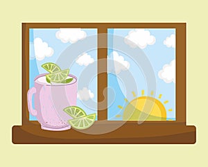 pitcher of lemonade on the window