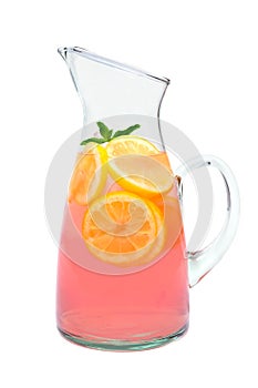 Pitcher of pink lemonade with mint isolated on white
