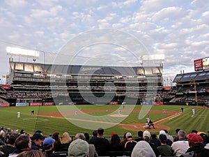 Pitcher throws pitch to batter with ball in air