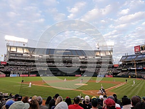 Pitcher throws pitch to batter with ball in air