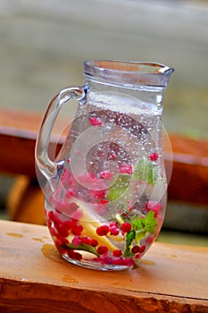 Pitcher of water and fruit.