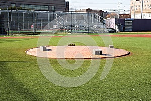 Pitchers mound covered with a tarp