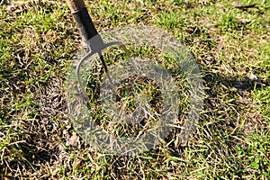 Pitchfork in the ground on farm