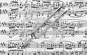 Pitchfork on sheet music - art background