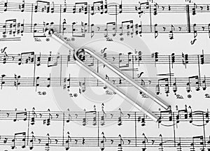 Pitchfork on sheet music - art background