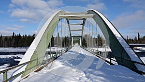 Piteaalven river bridge at Ljusselfoss in Swedish Lapland.