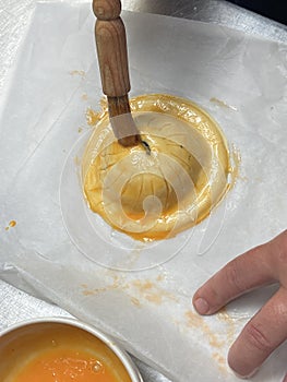 Pithivier french pastry pie being made and glaze