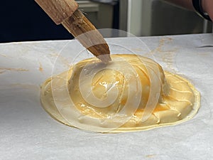 Pithivier french pastry pie being made and glaze