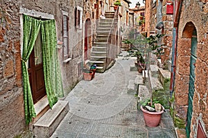 Pitigliano, Grosseto, Tuscany, Italy: old alley in the ancient town photo