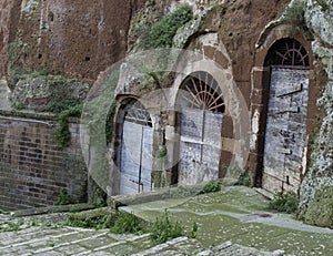 Pitigliano, one of the best town in Tuscany, Italy. Cellar doors in the medieval district.