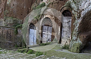 Pitigliano, one of the best town in Tuscany, Italy. Cellar doors in the medieval district.