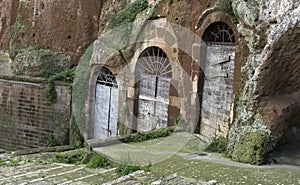 Pitigliano, one of the best town in Tuscany, Italy. Cellar doors in the medieval district.