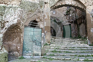 Pitigliano, one of the best town in Tuscany, Italy. Cellar doors in the medieval district.