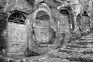 Pitigliano, one of the best town in Tuscany, Italy. Cellar doors in the medieval district.