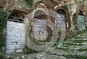 Pitigliano, one of the best town in Tuscany, Italy. Cellar doors in the medieval district.