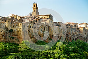 Pitigliano town, located atop a volcanic tufa ridge, known as the little Jerusalem, surrounded by lush valleys carved by the Lente photo