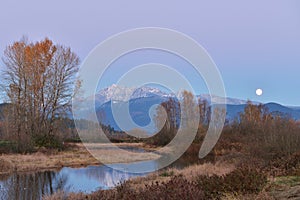 Pitt River and Golden Ears Mountain at sunset and moonrise